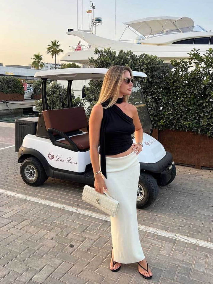 Damska torebka z plecionej skóry ze złotym zapięciem typu twist